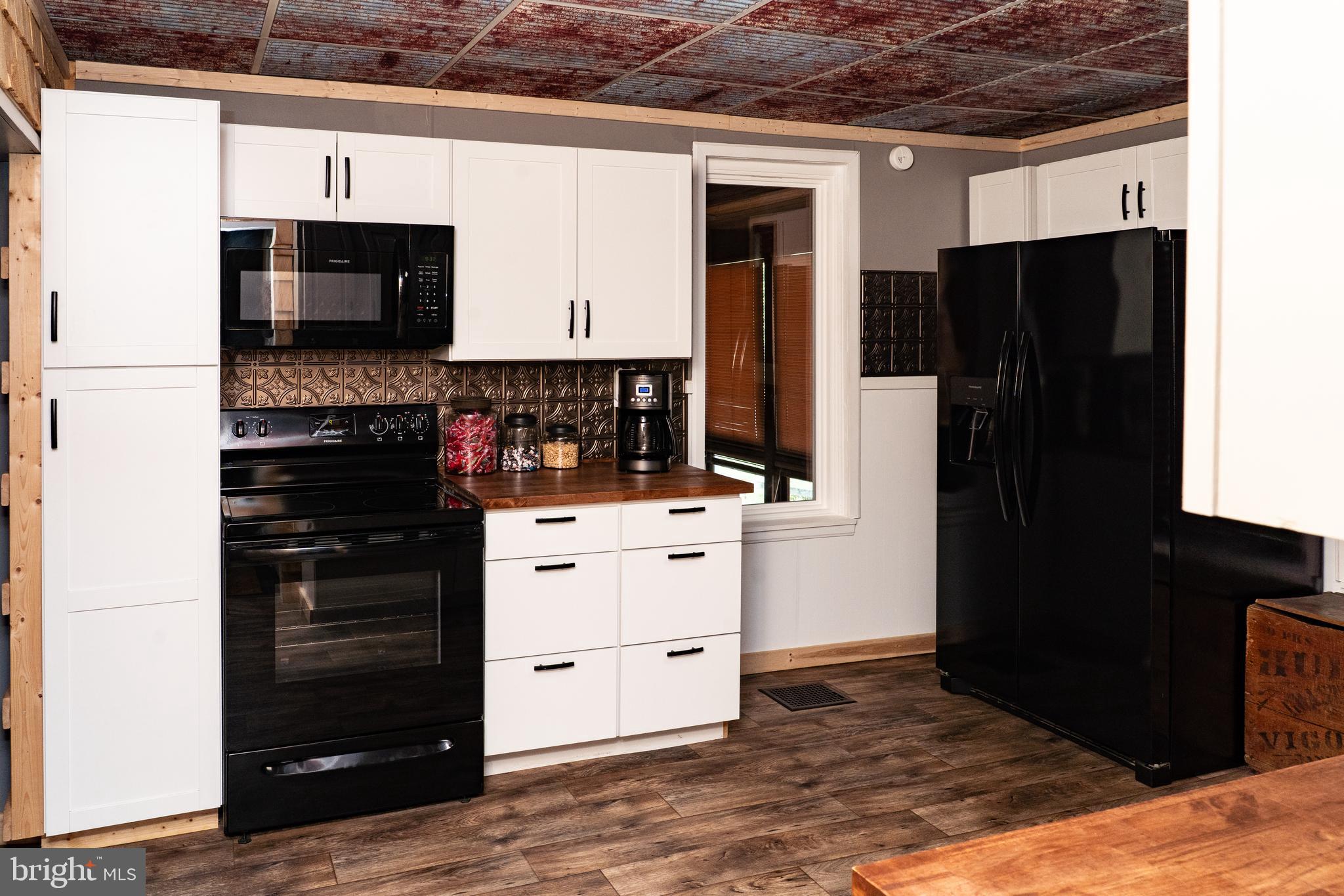 420 Locust Street Burnham, PA 17009 - Photo 19 of 59 a kitchen with a refrigerator and a stove