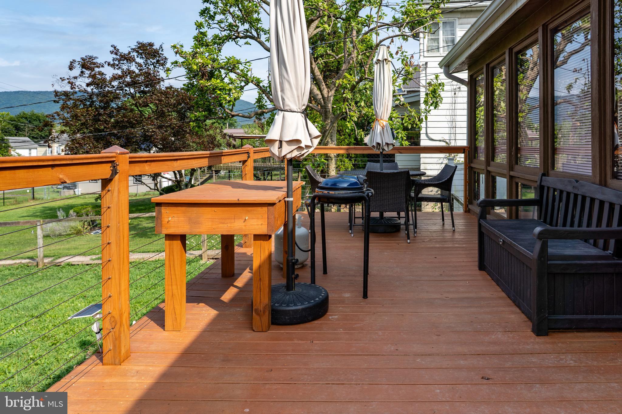 420 Locust Street Burnham, PA 17009 - Photo 47 of 59 a view of a patio with table and chairs potted plants and floor to ceiling window