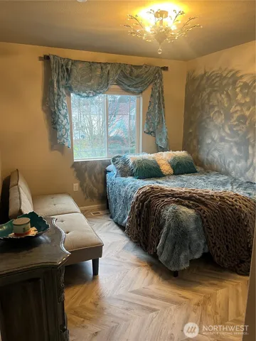 a living room with a bed and a couch