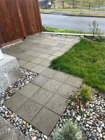 a view of a pathway gate and a yard