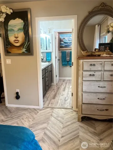 a view of a hallway with washer and dryer