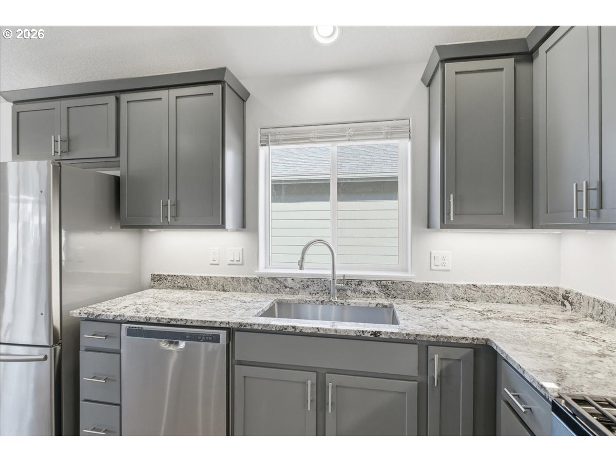 2046 Southeast Academy Street Dallas, OR 97338 - Photo 17 of 47 a bathroom with a granite countertop sink and a mirror