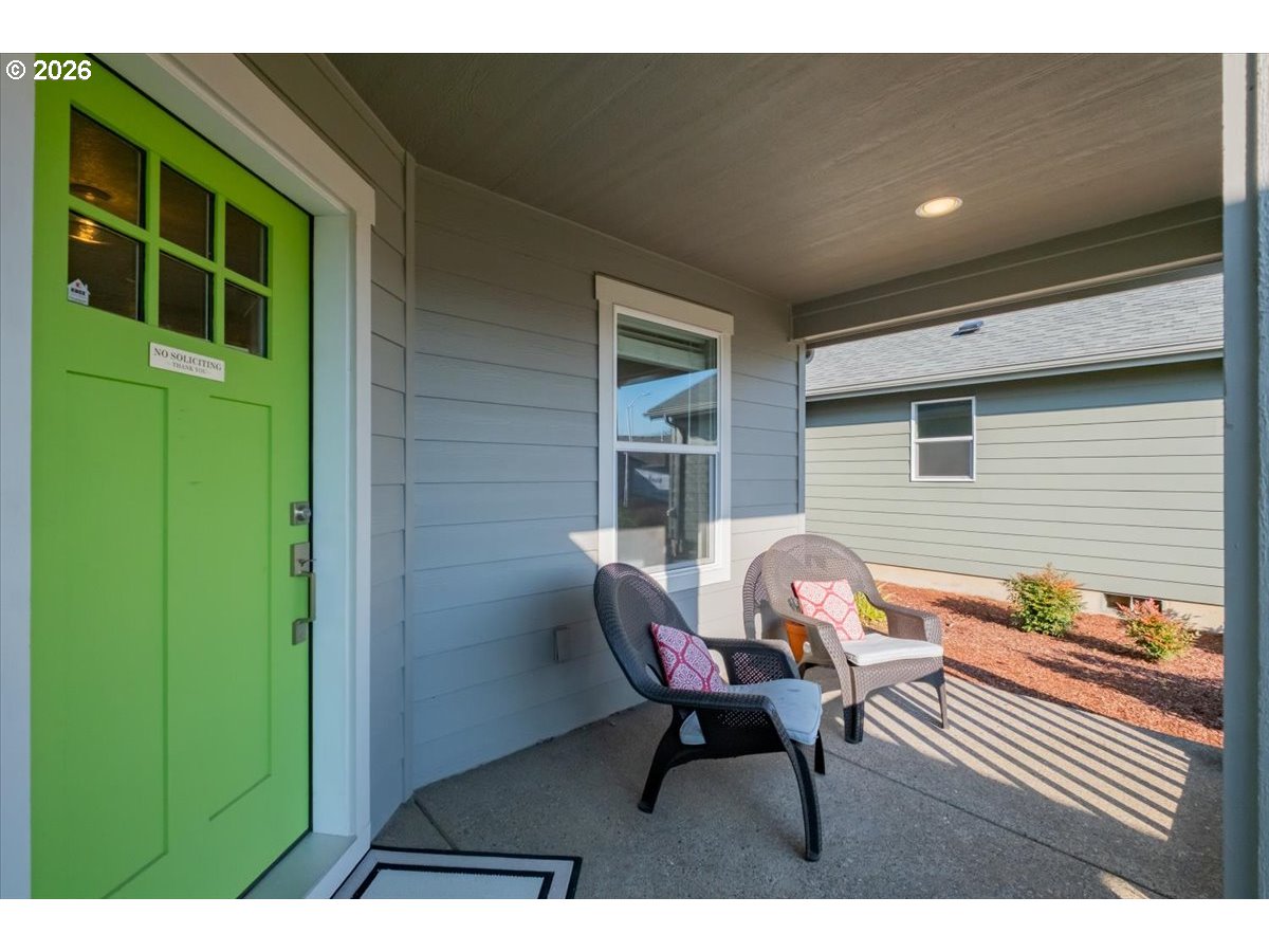 2046 Southeast Academy Street Dallas, OR 97338 - Photo 2 of 47 a backyard of a house with table and chairs