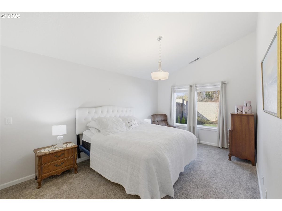 2046 Southeast Academy Street Dallas, OR 97338 - Photo 22 of 47 a bedroom with a bed and a view mirror