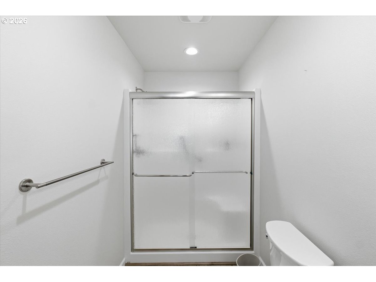 2046 Southeast Academy Street Dallas, OR 97338 - Photo 26 of 47 a picture of a bathroom with a shower and a glass door