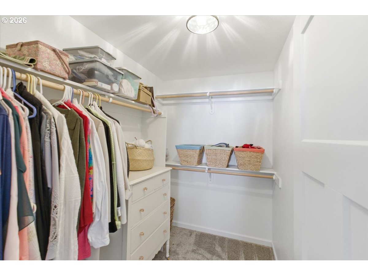 2046 Southeast Academy Street Dallas, OR 97338 - Photo 28 of 47 a view of walk in closet with clothes and shoes