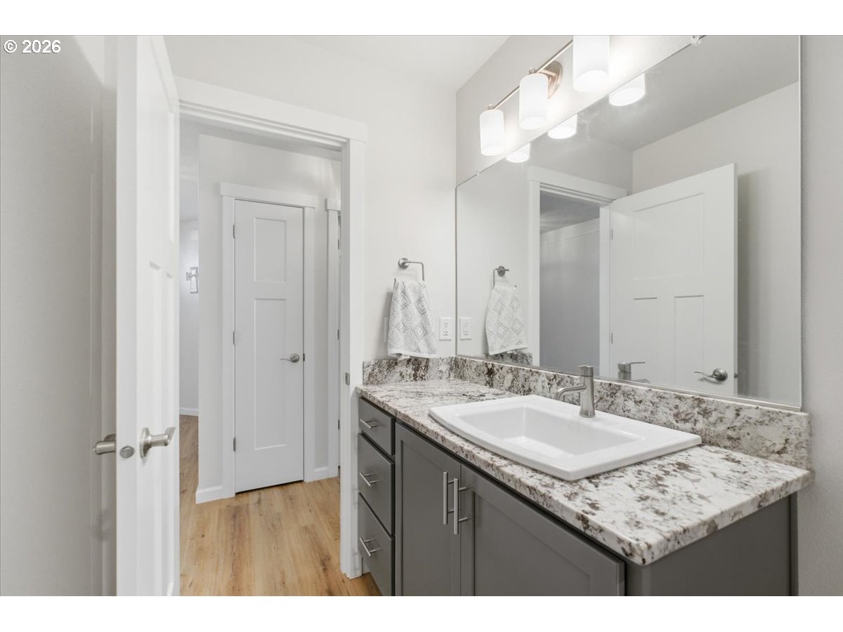 2046 Southeast Academy Street Dallas, OR 97338 - Photo 35 of 47 a bathroom with a sink vanity and a mirror