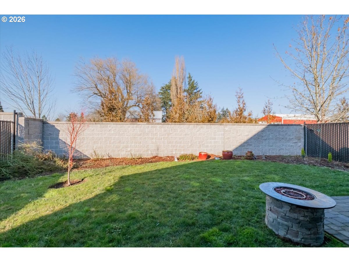 2046 Southeast Academy Street Dallas, OR 97338 - Photo 44 of 47 a view of a backyard with plants and a lawn chairs