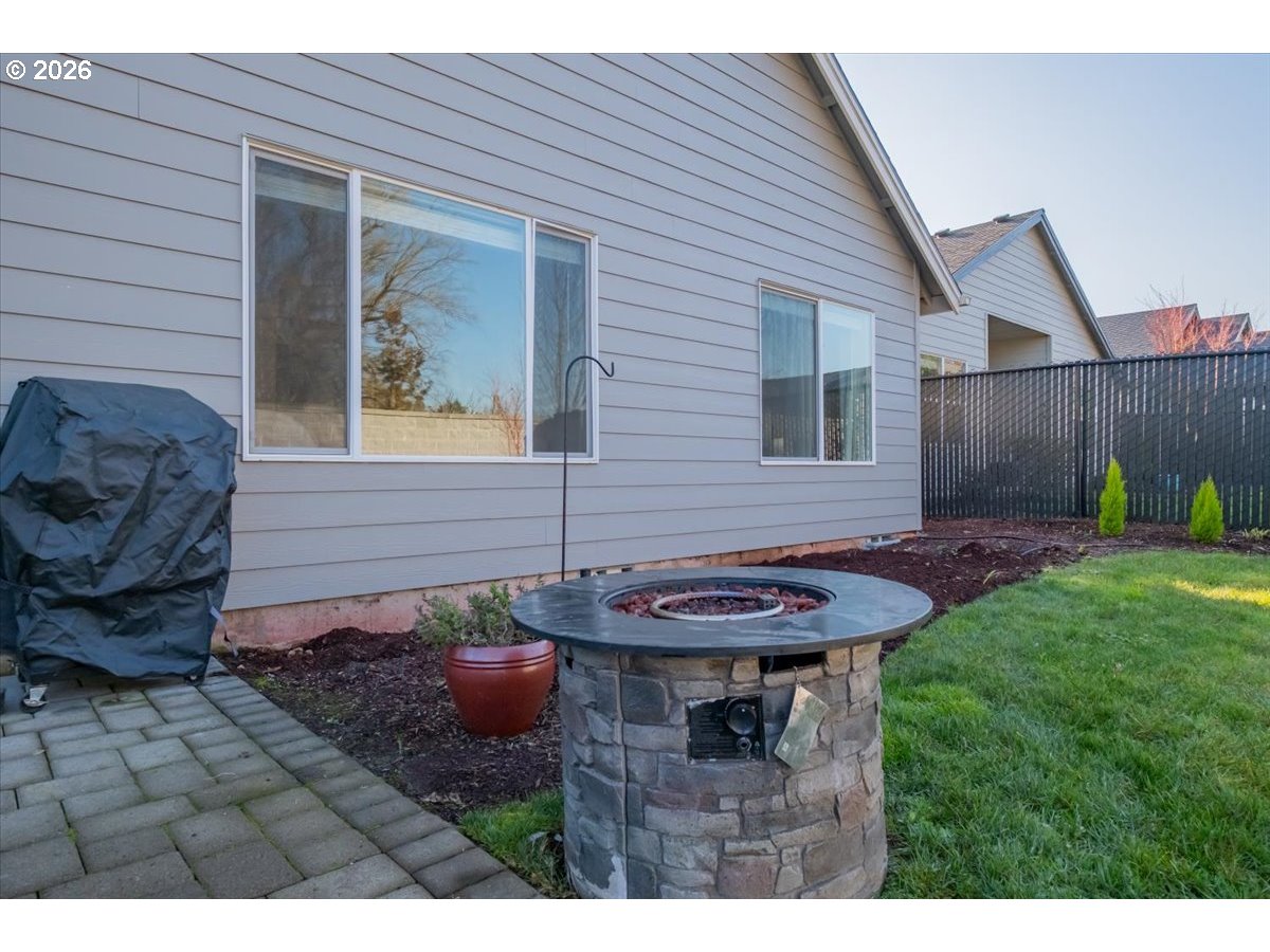 2046 Southeast Academy Street Dallas, OR 97338 - Photo 47 of 47 a backyard of a house with barbeque oven