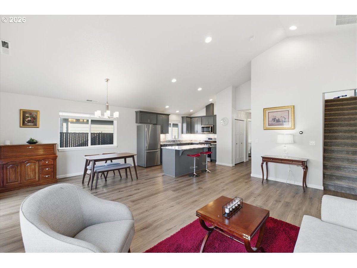 2046 Southeast Academy Street Dallas, OR 97338 - Photo 9 of 47 a living room with furniture a table and wooden floor