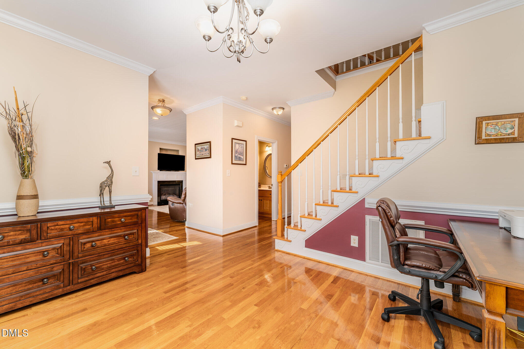 272 Travel Lite Drive Raleigh, NC 27603 - Photo 12 of 30 a view of a livingroom with wooden floor and furniture
