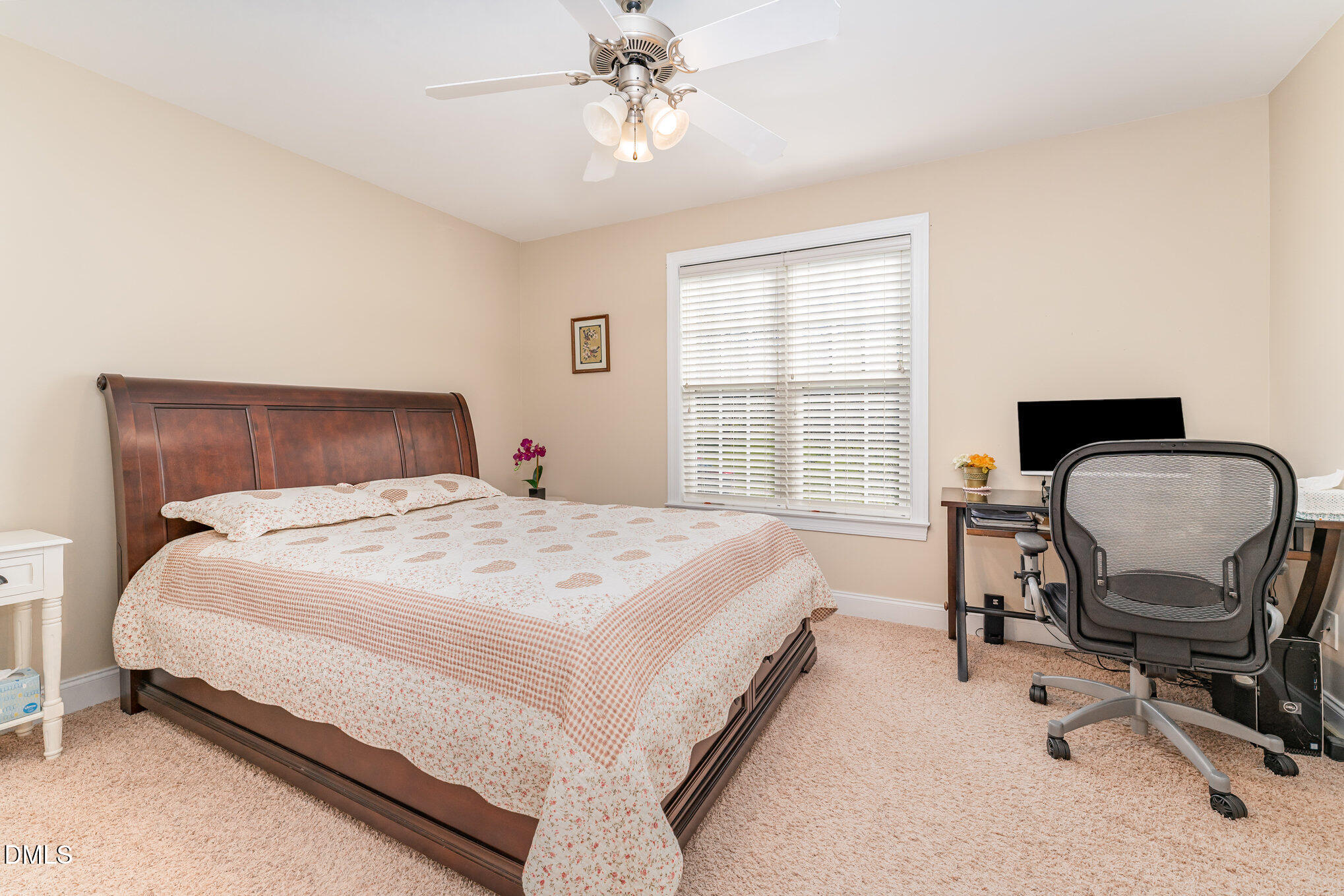 272 Travel Lite Drive Raleigh, NC 27603 - Photo 15 of 30 a bedroom with a bed chair and a chandelier