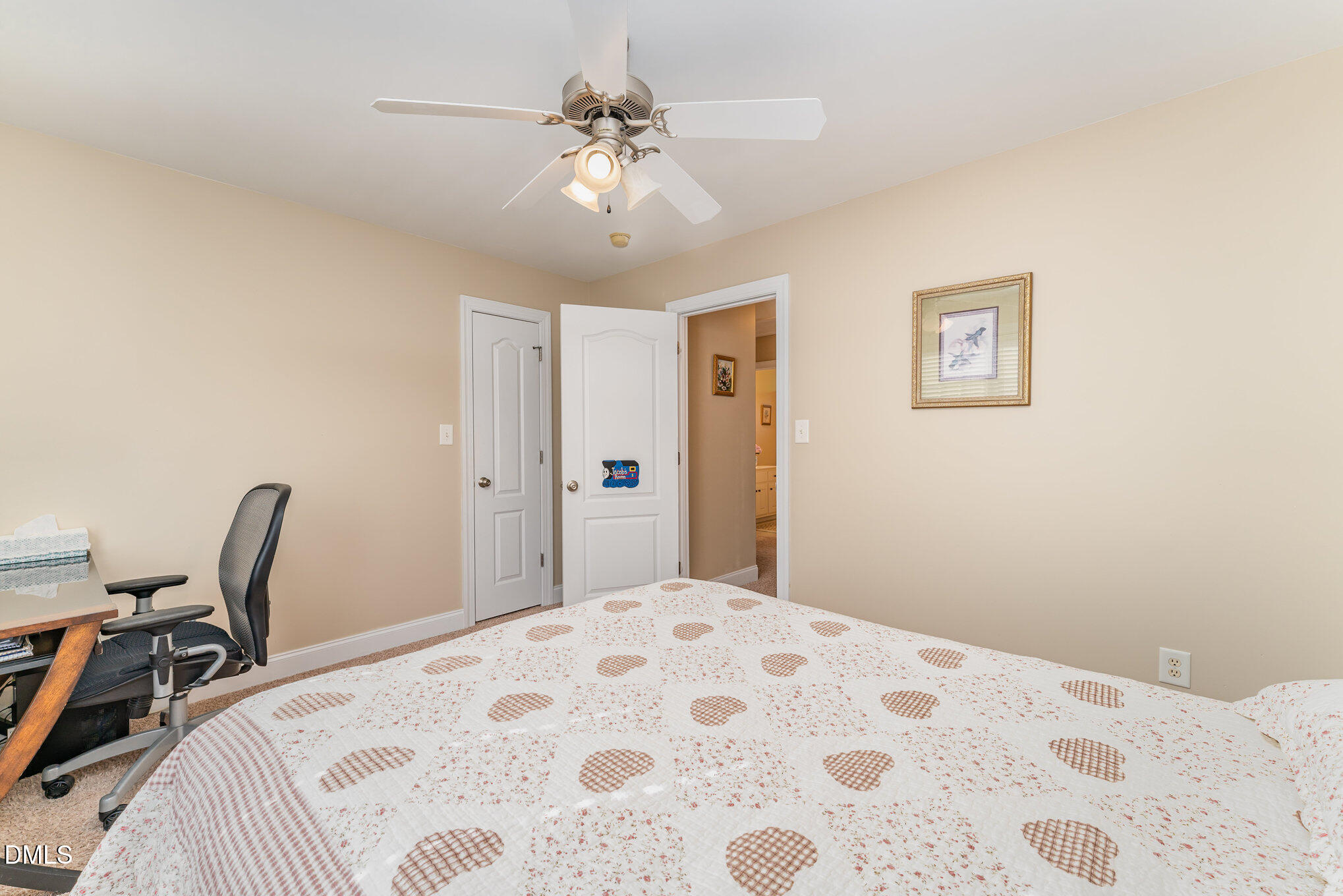 272 Travel Lite Drive Raleigh, NC 27603 - Photo 16 of 30 a bedroom with a large bed and a chandelier