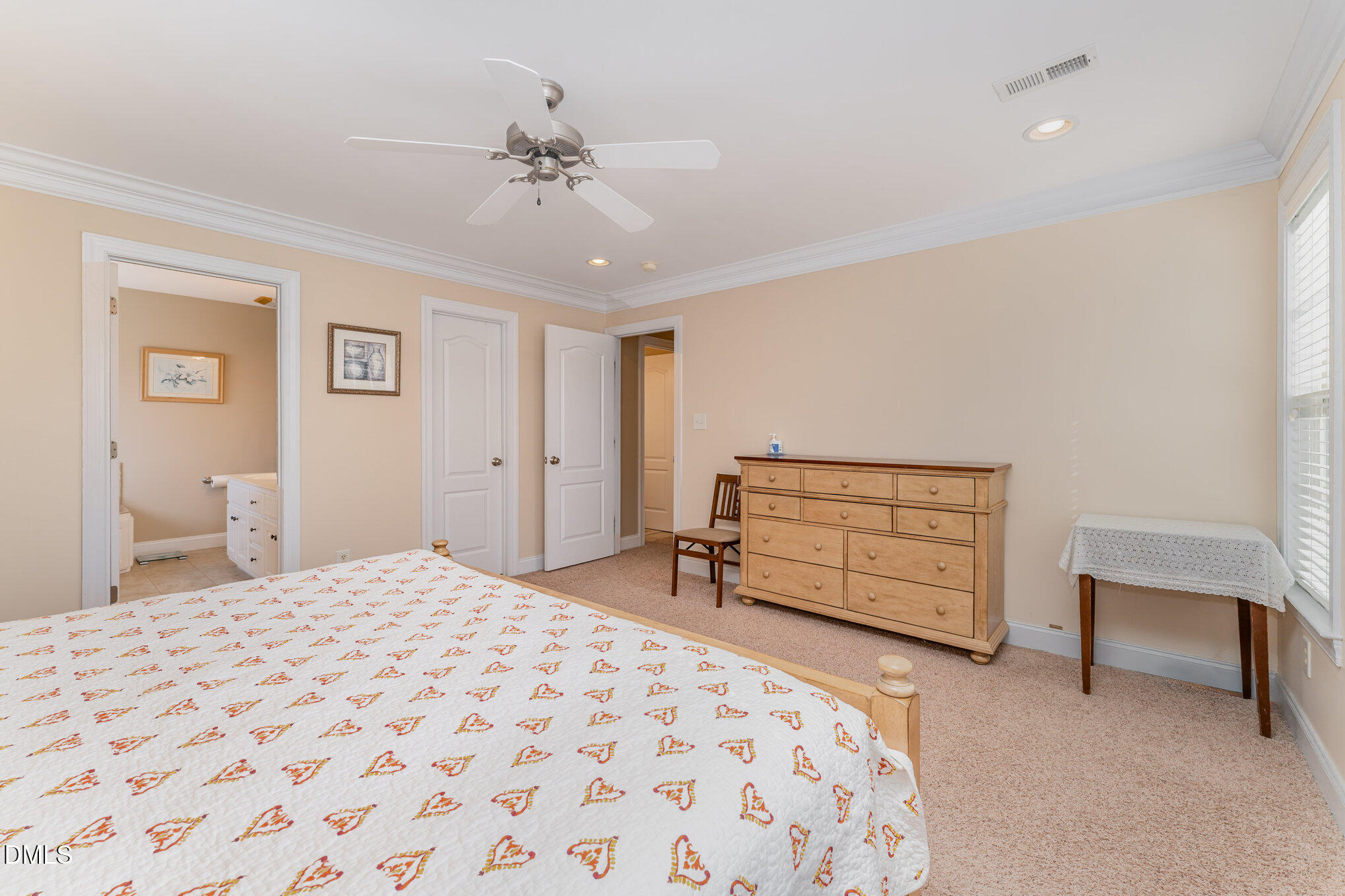 272 Travel Lite Drive Raleigh, NC 27603 - Photo 18 of 30 a bedroom with a bed and a chair