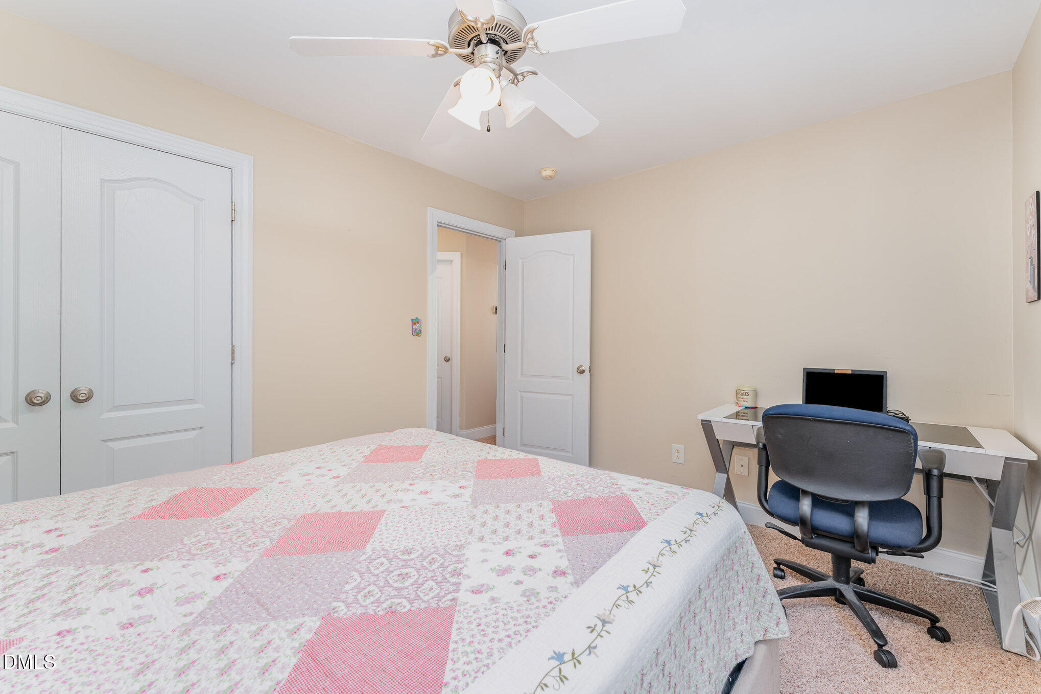 272 Travel Lite Drive Raleigh, NC 27603 - Photo 23 of 30 a bedroom with a bed a desk and chair