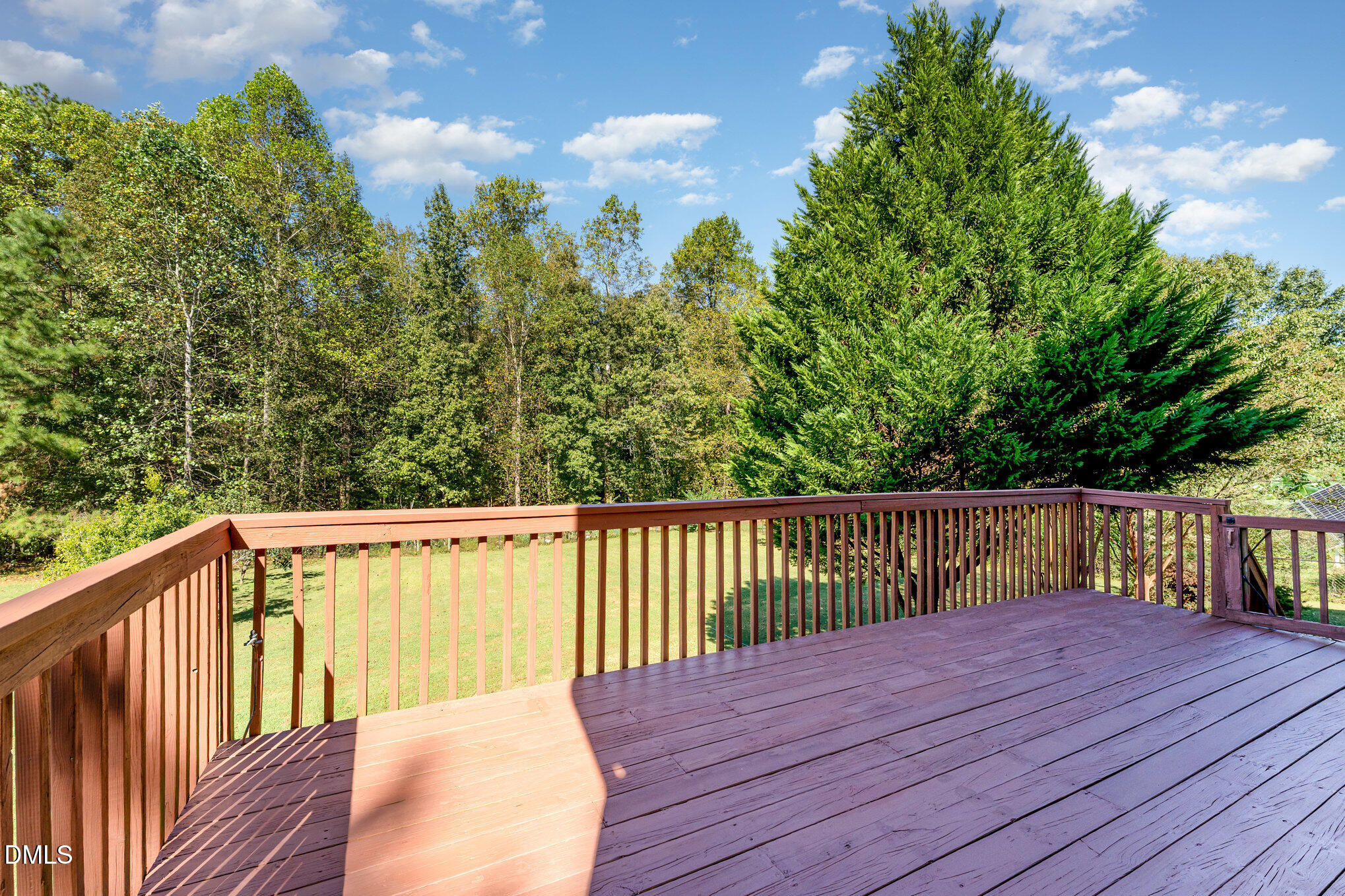 272 Travel Lite Drive Raleigh, NC 27603 - Photo 24 of 30 a balcony with wooden floor and fence