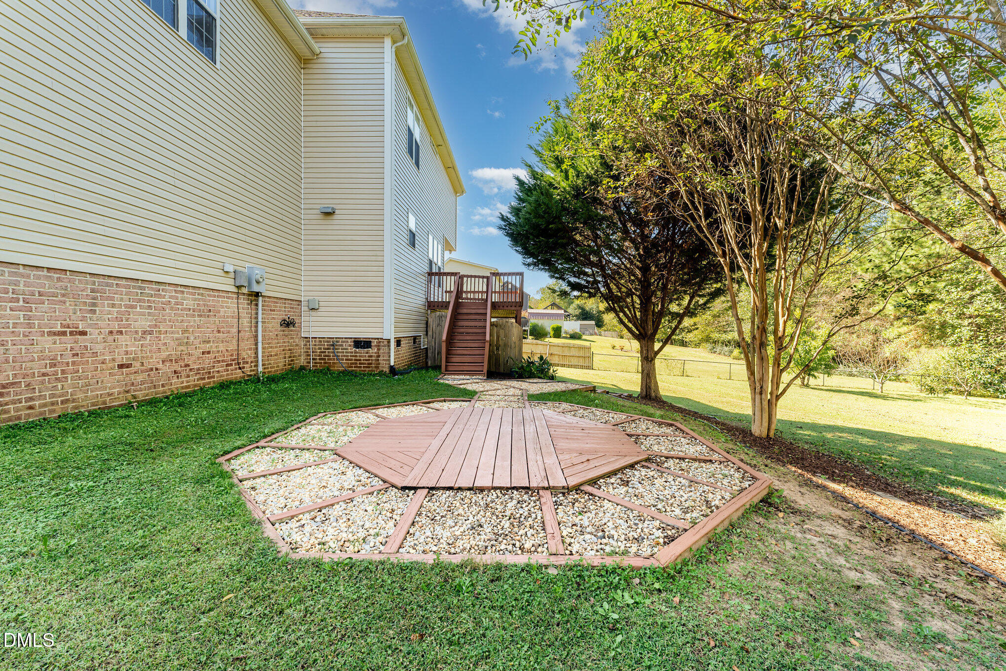 272 Travel Lite Drive Raleigh, NC 27603 - Photo 25 of 30 a view of a backyard with large tree