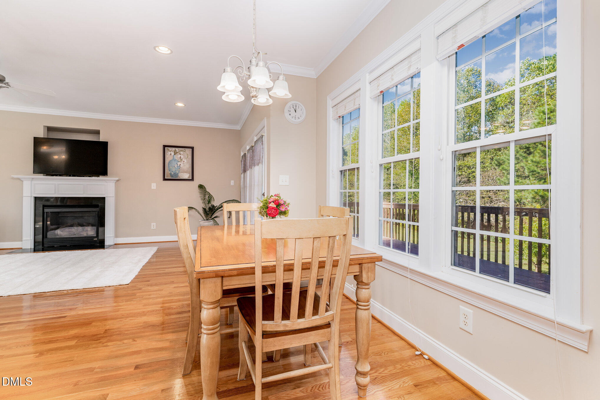 272 Travel Lite Drive Raleigh, NC 27603 - Photo 7 of 30 a view of a dining room with furniture window and wooden floor