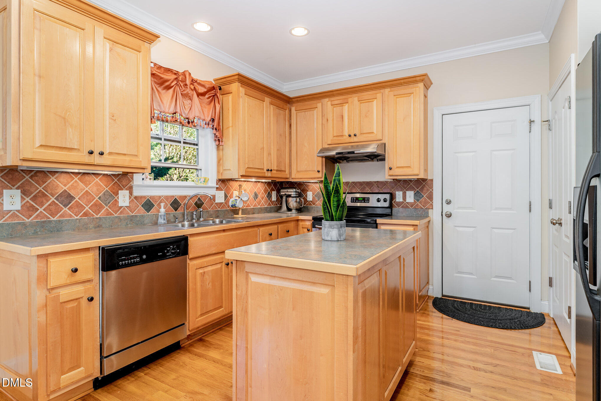 272 Travel Lite Drive Raleigh, NC 27603 - Photo 8 of 30 a kitchen with stainless steel appliances granite countertop a sink a stove and a refrigerator