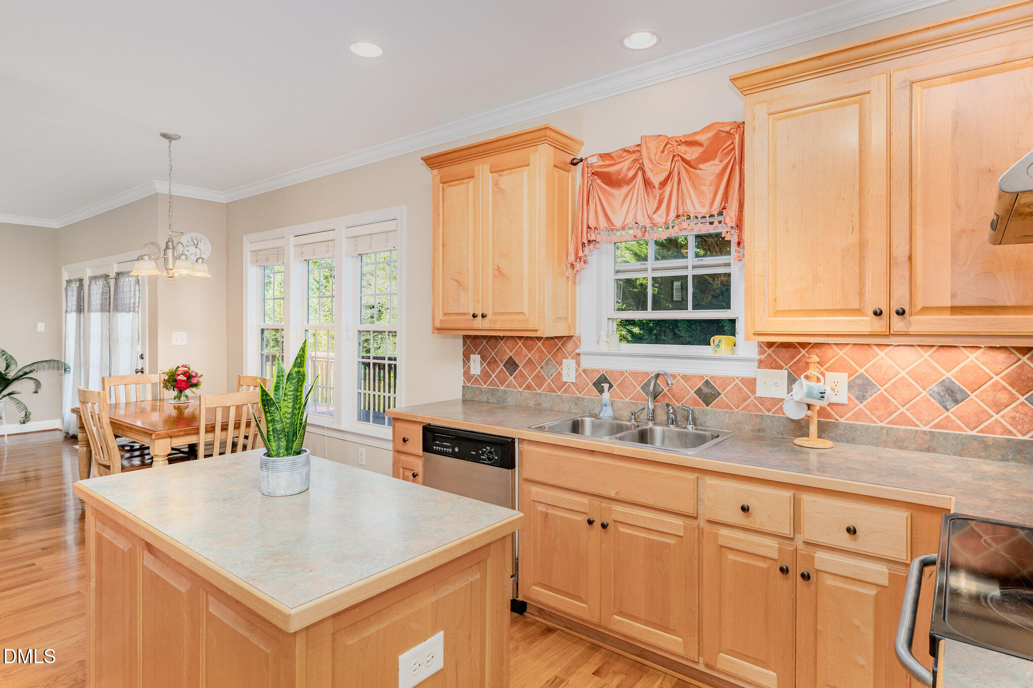 272 Travel Lite Drive Raleigh, NC 27603 - Photo 9 of 30 a kitchen with a sink stove and cabinets