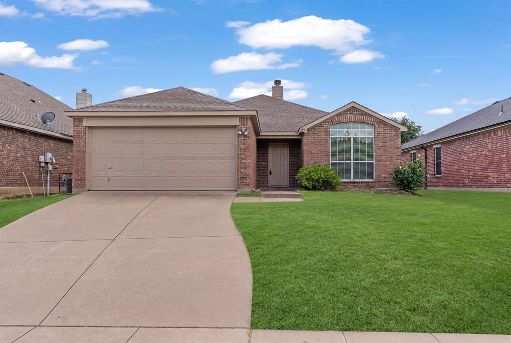 834 Hazel's Way Anna, TX 75409 - Photo 2 of 21 Traditional brick residence featuring an arched window, a two-car garage, and a concrete driveway