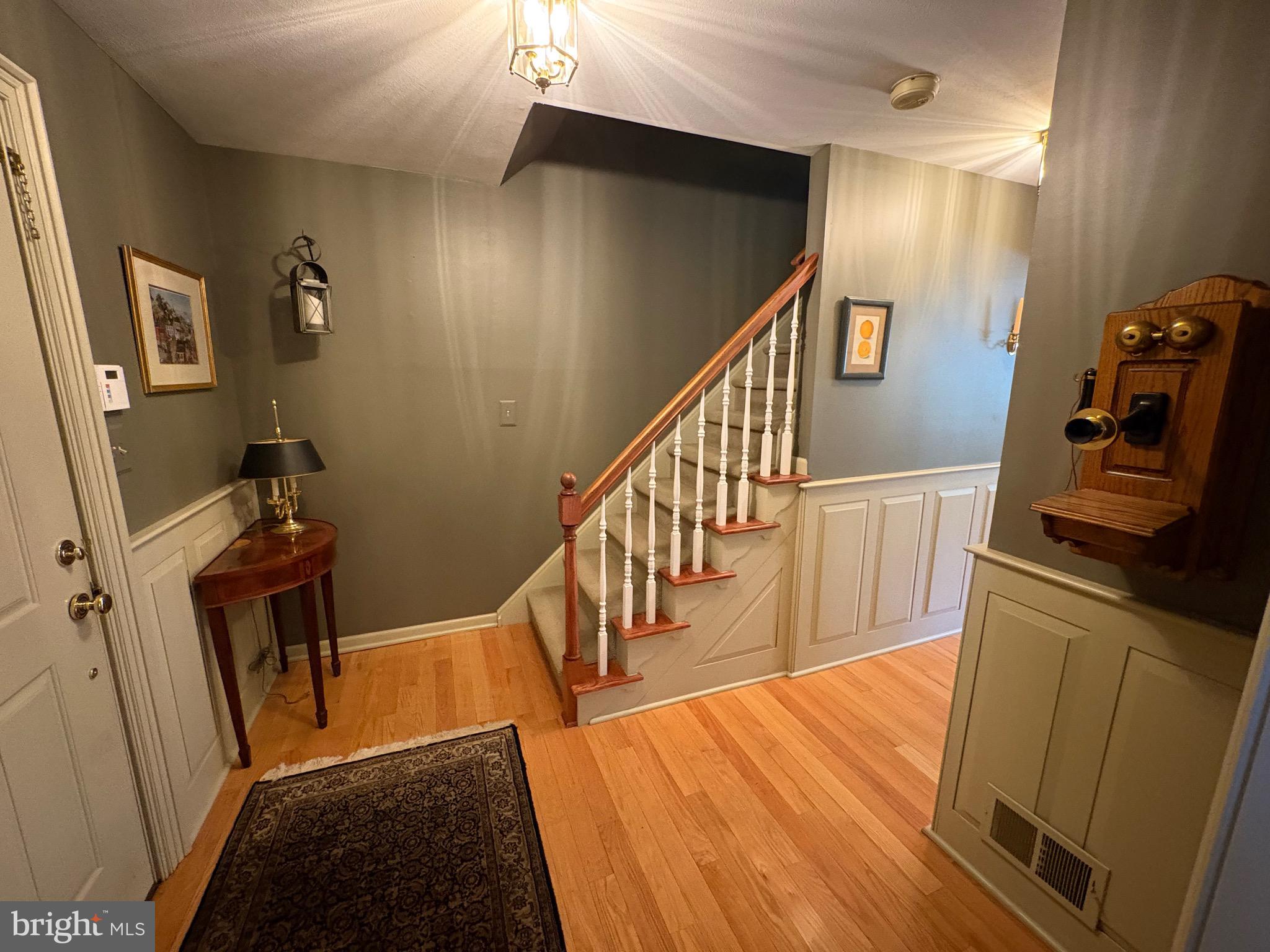 4503 Crosswicks Hamilton Square Road Robbinsville, NJ 08691 - Photo 3 of 44 a view of a hallway with wooden floor and staircase