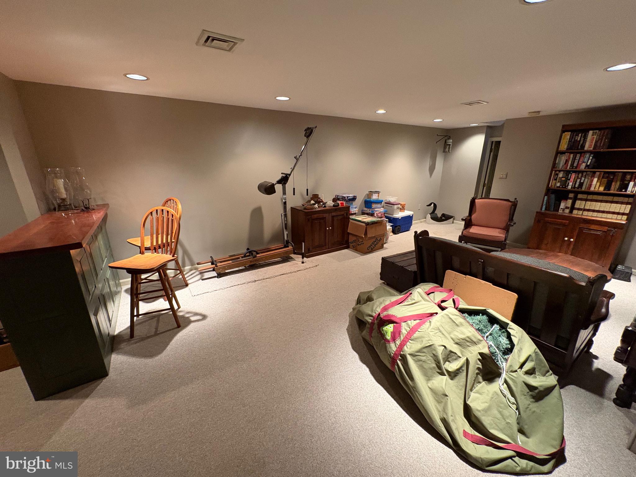 4503 Crosswicks Hamilton Square Road Robbinsville, NJ 08691 - Photo 31 of 44 a bedroom with furniture and a book shelf