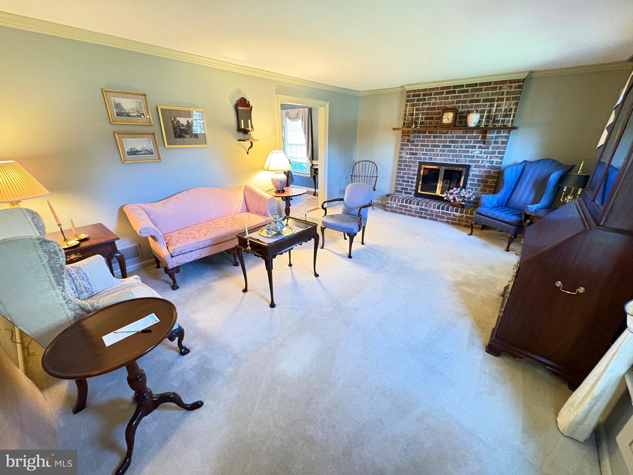 4503 Crosswicks Hamilton Square Road Robbinsville, NJ 08691 - Photo 33 of 44 a living room with furniture and a fireplace