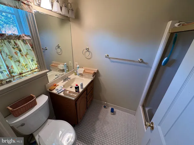 a view of a backyard with pathway