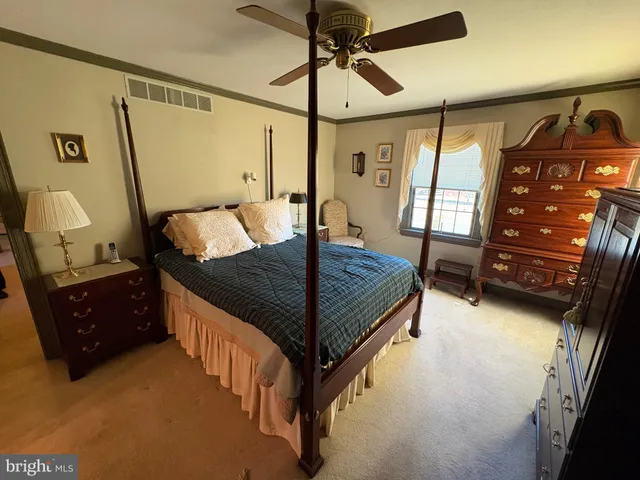 a view of room with furniture and wooden floor
