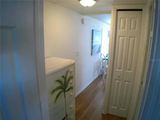 a bedroom with a bed and a mirror