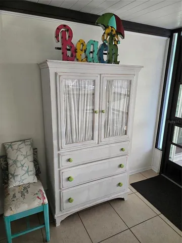 a view of a kitchen with furniture and window