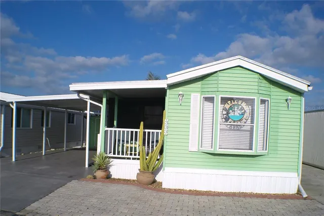 a view of a chair and table in the patio