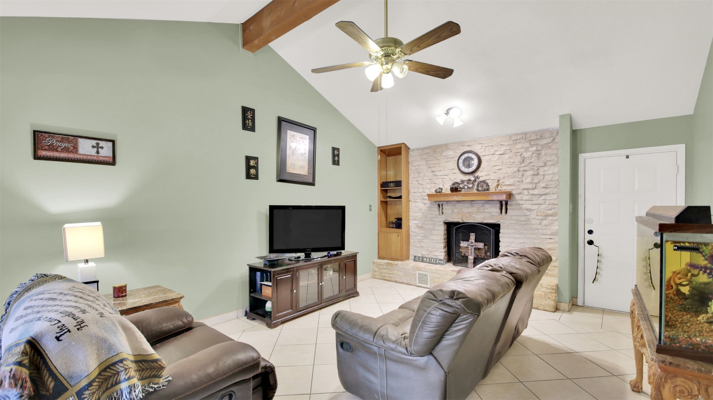1713 Parkside Circle Round Rock, TX 78664 - Photo 3 of 18 a living room with furniture a fireplace and a flat screen tv