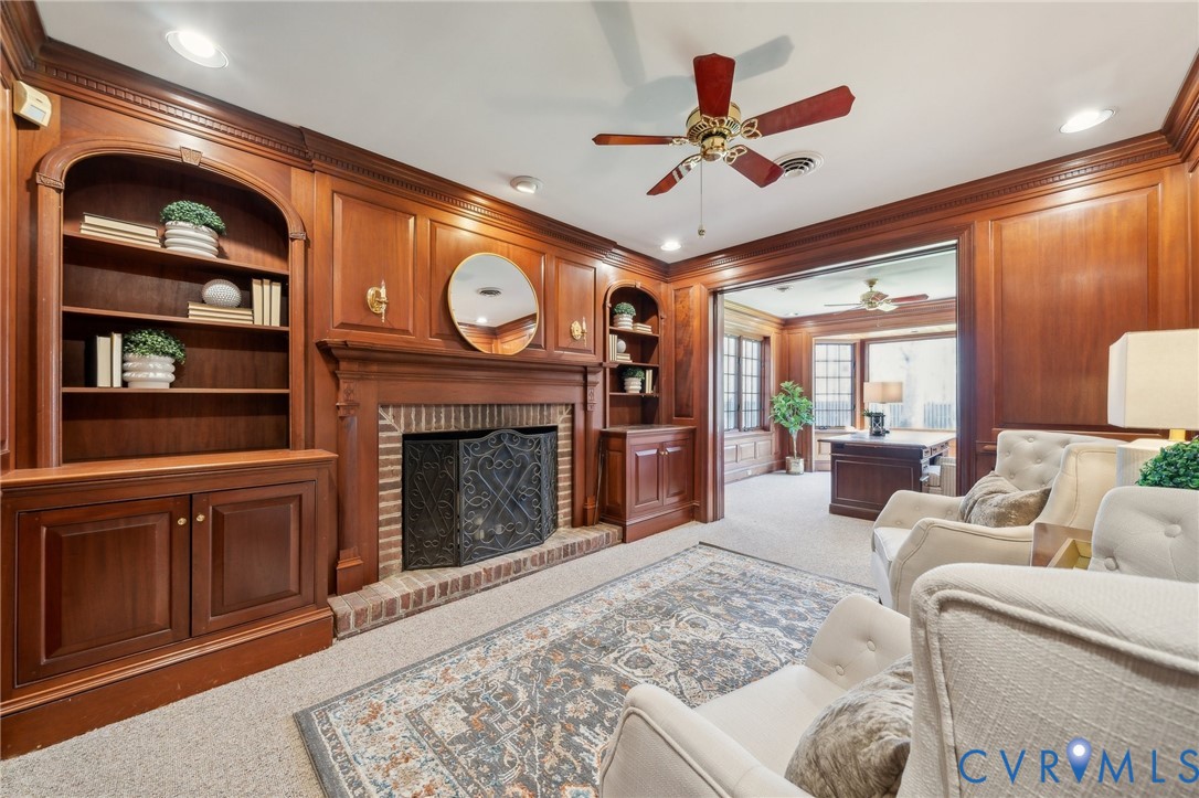 4411 Courthouse Road Prince George, VA 23875 - Photo 12 of 38 a living room with furniture a fireplace and a large window