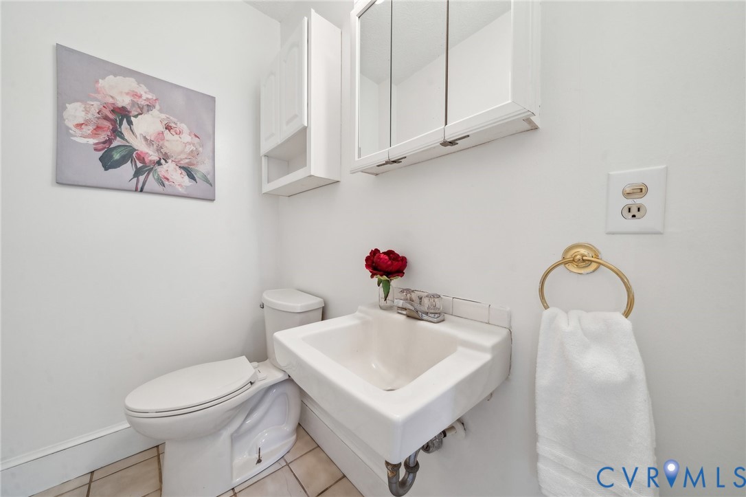 4411 Courthouse Road Prince George, VA 23875 - Photo 15 of 38 a white toilet sitting next to a bathroom sink