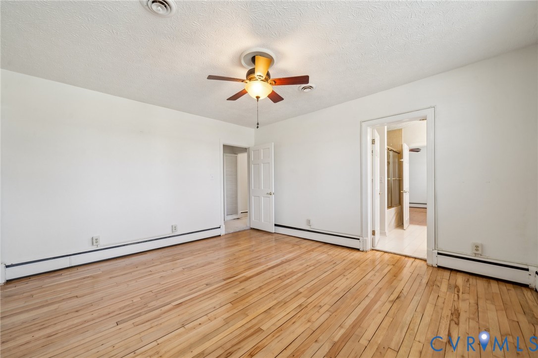 4411 Courthouse Road Prince George, VA 23875 - Photo 17 of 38 wooden floor in an empty room with a window