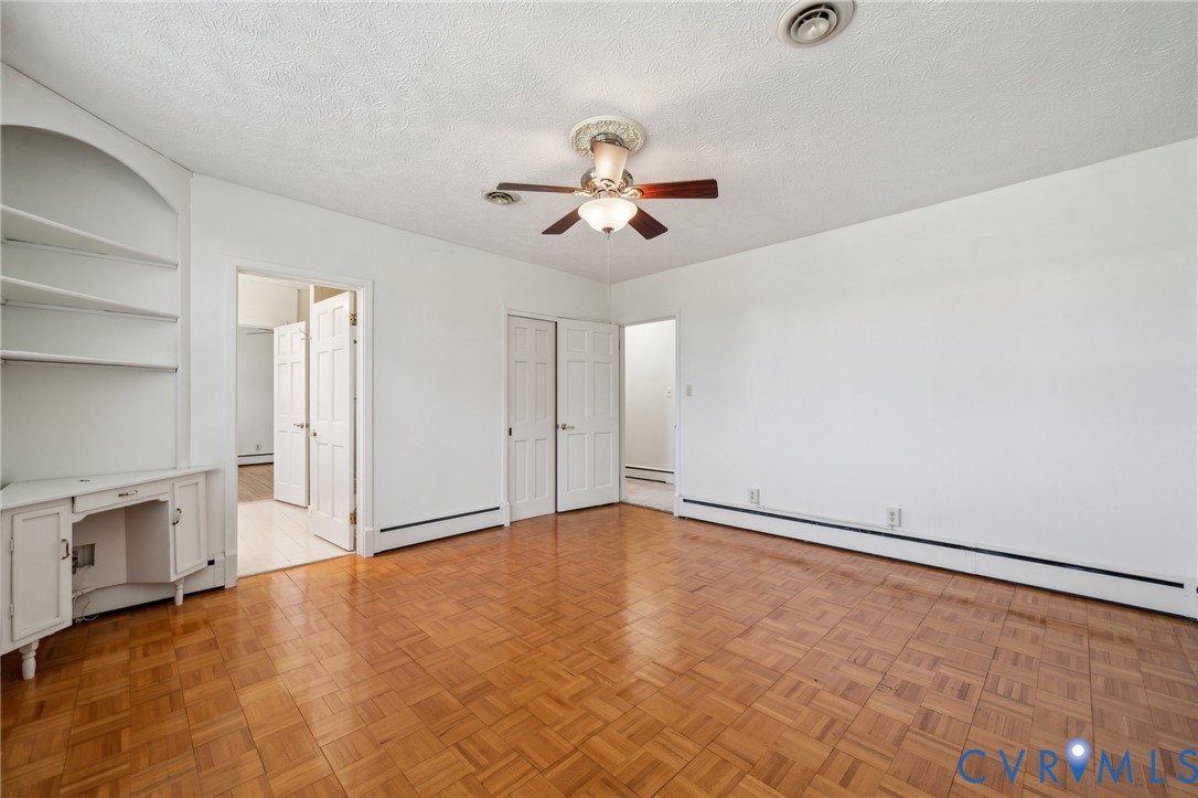 4411 Courthouse Road Prince George, VA 23875 - Photo 20 of 38 an empty room with chandelier fan and windows