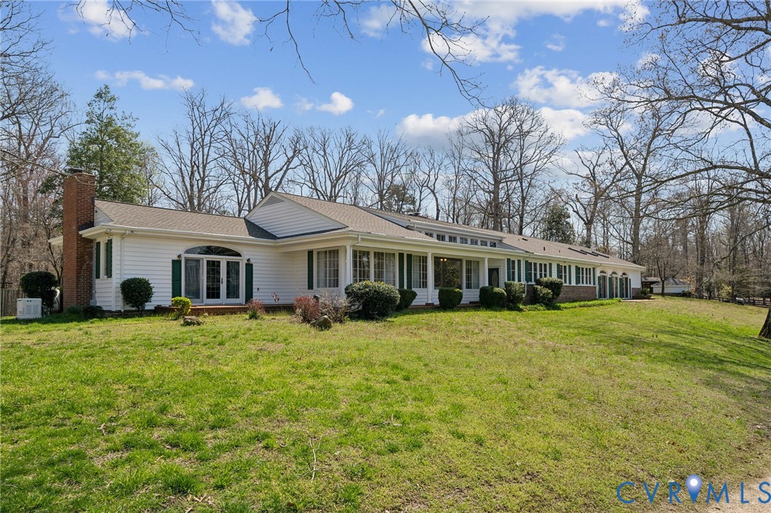 4411 Courthouse Road Prince George, VA 23875 - Photo 2 of 38 a front view of a house with a garden