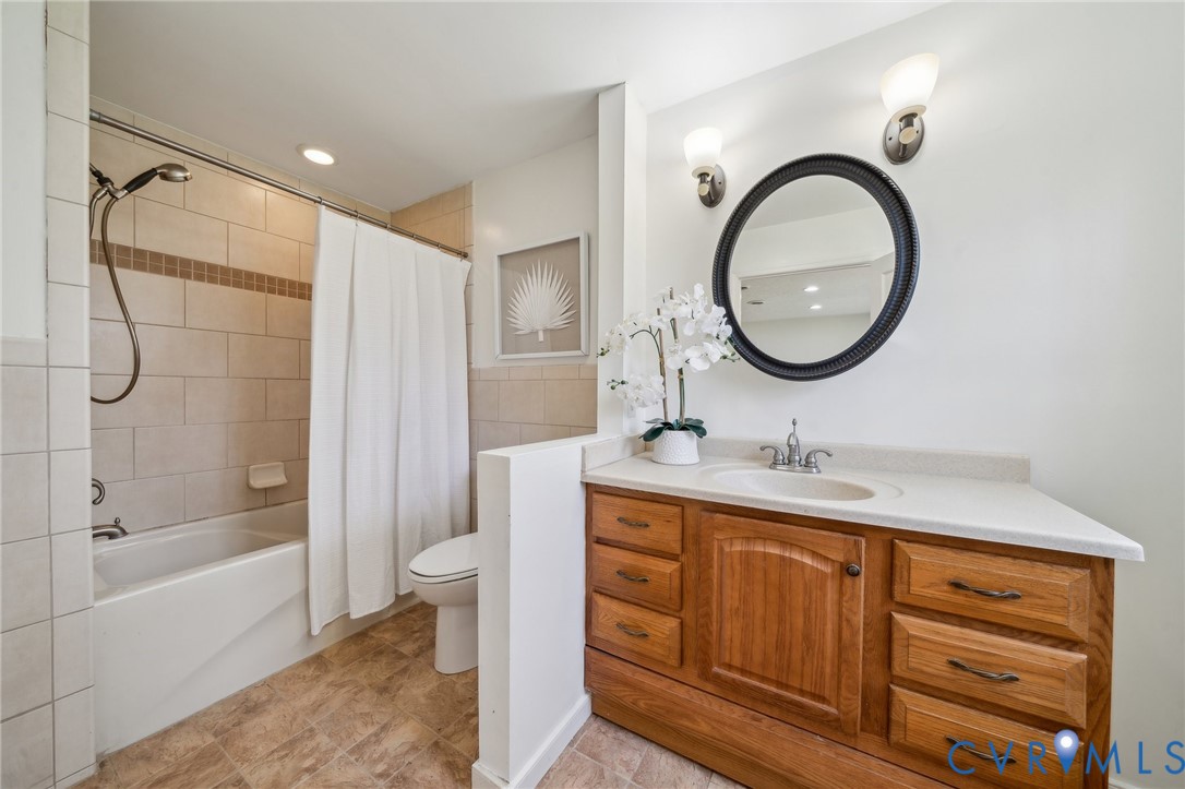 4411 Courthouse Road Prince George, VA 23875 - Photo 25 of 38 a bathroom with a toilet sink and mirror