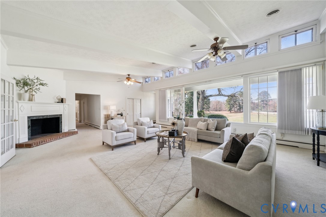 4411 Courthouse Road Prince George, VA 23875 - Photo 9 of 38 a living room with furniture two window and a fireplace