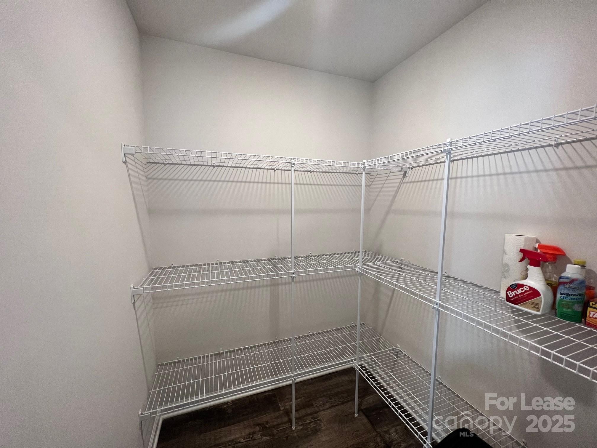 7868 Whispering Stream Drive Sherrills Ford, NC 28673 - Photo 11 of 35 a view of storage and utility room with racks on the wall