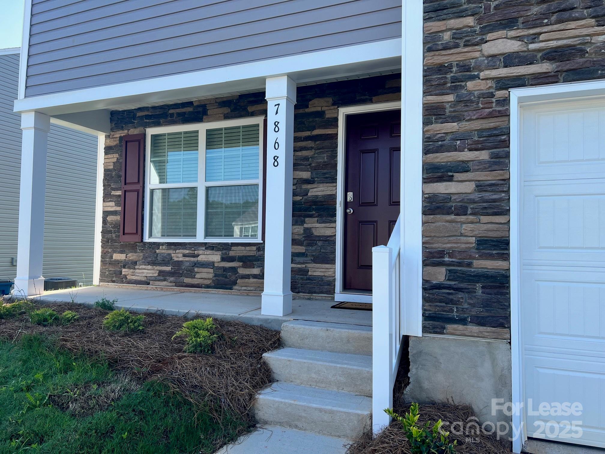 7868 Whispering Stream Drive Sherrills Ford, NC 28673 - Photo 2 of 35 a front view of a house with a yard