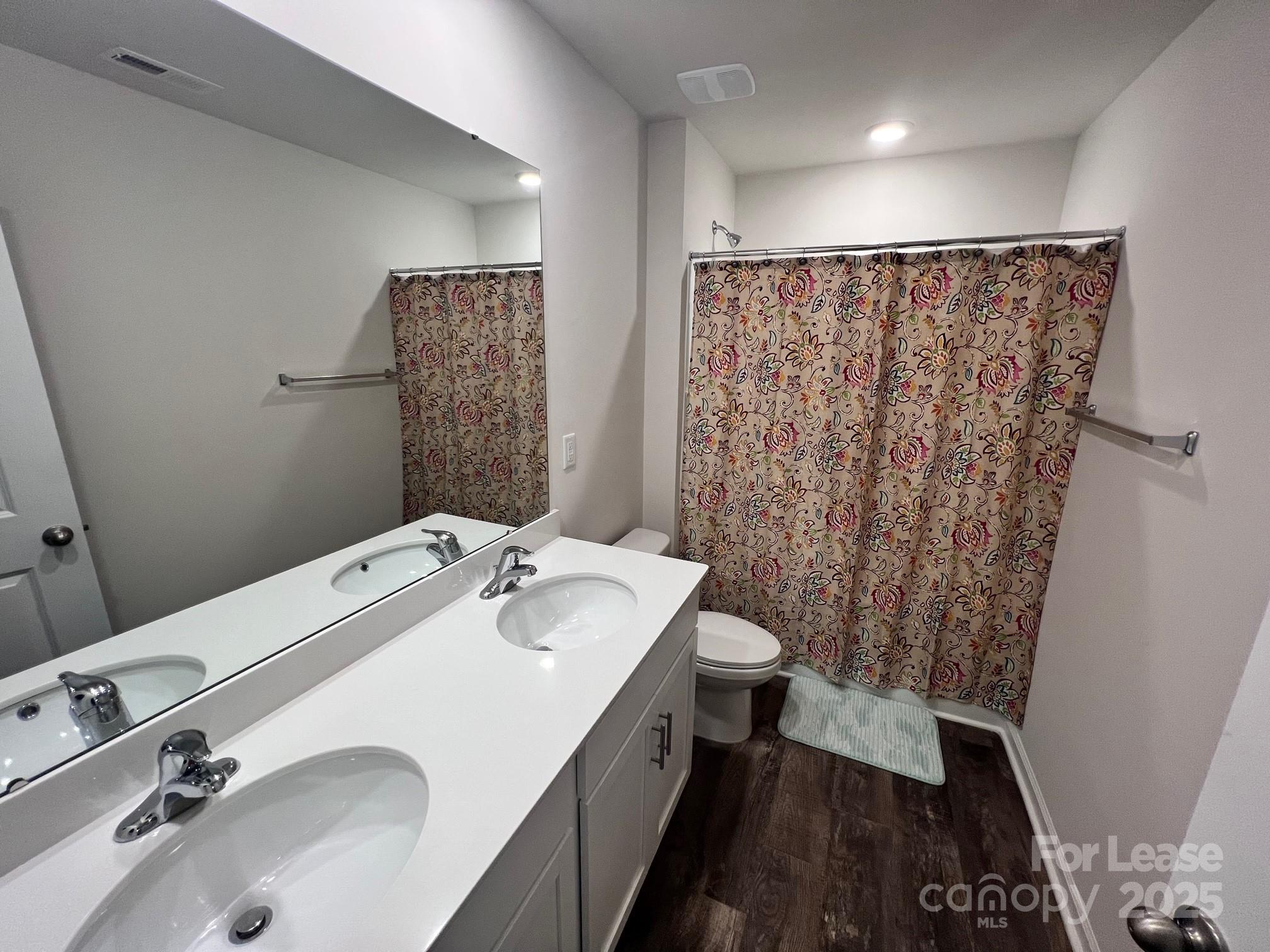 7868 Whispering Stream Drive Sherrills Ford, NC 28673 - Photo 22 of 35 a bathroom with a sink and a mirror