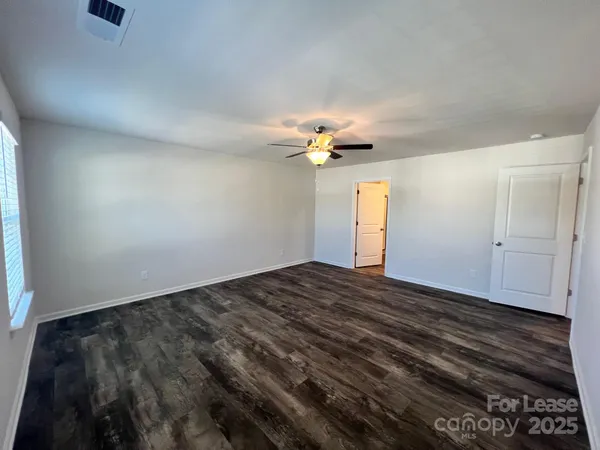 a bathroom with a double vanity sink and mirror