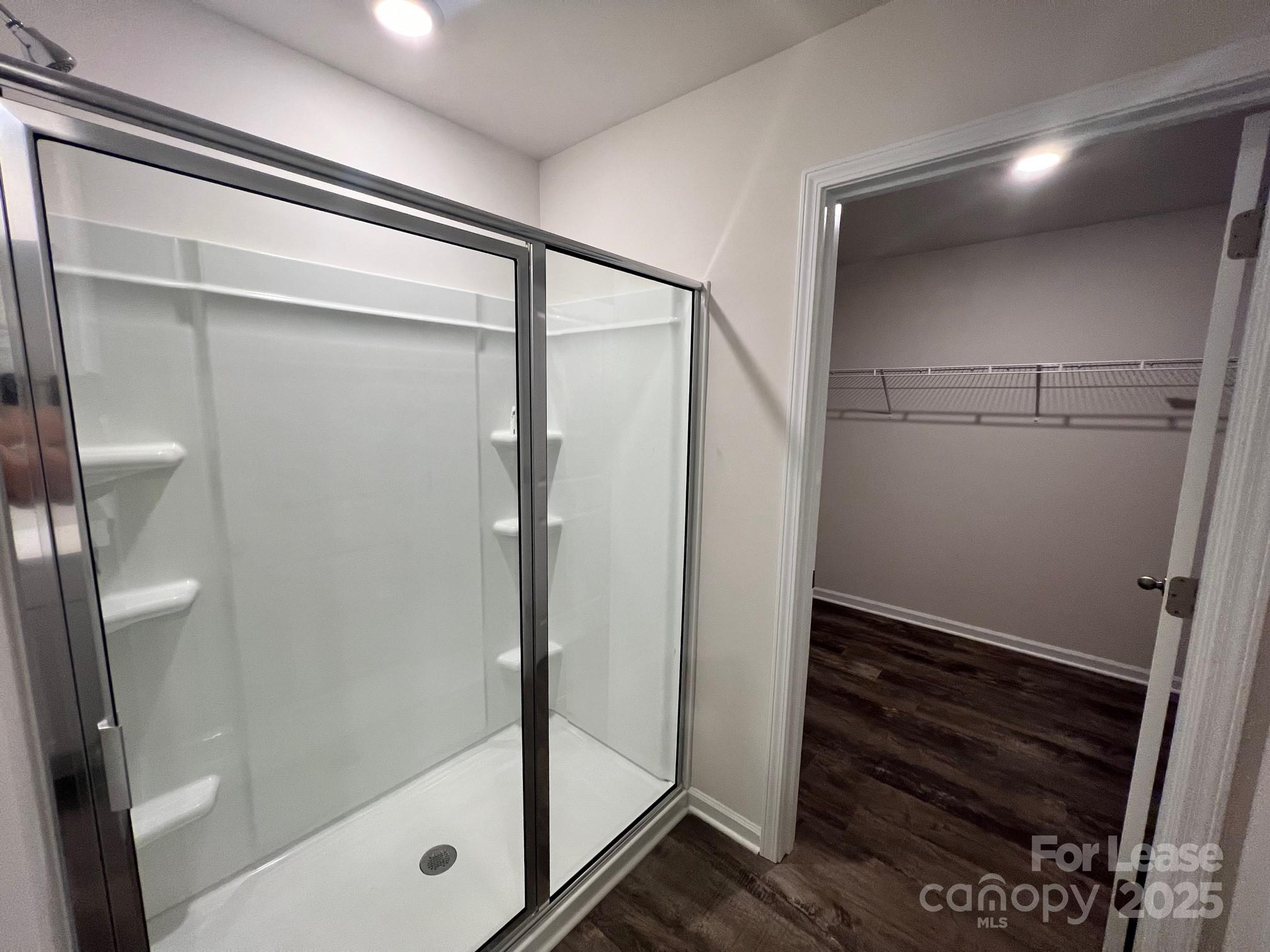 7868 Whispering Stream Drive Sherrills Ford, NC 28673 - Photo 27 of 35 a bathroom with a glass shower door