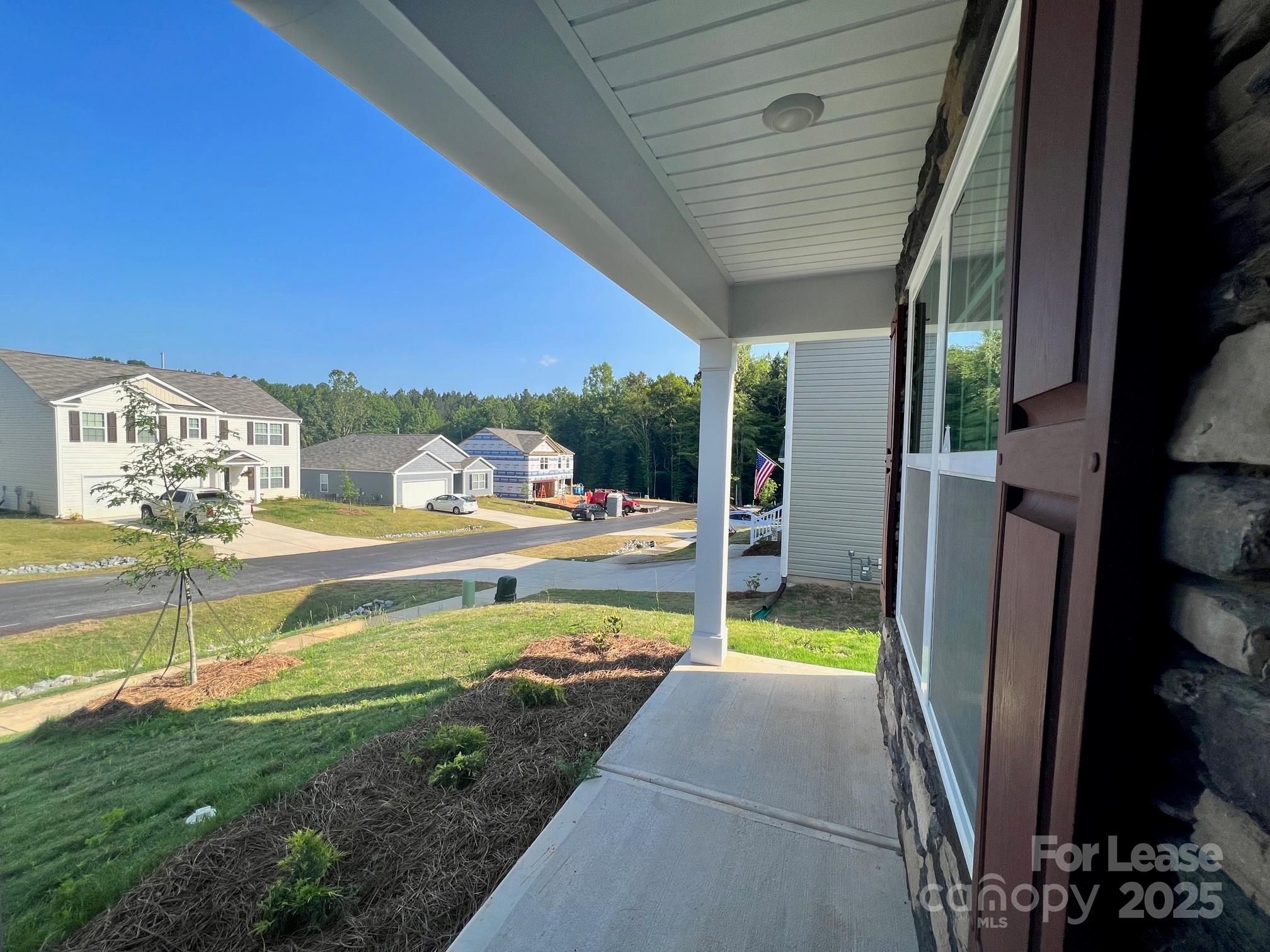 7868 Whispering Stream Drive Sherrills Ford, NC 28673 - Photo 3 of 35 a view of swimming pool with a garden and patio