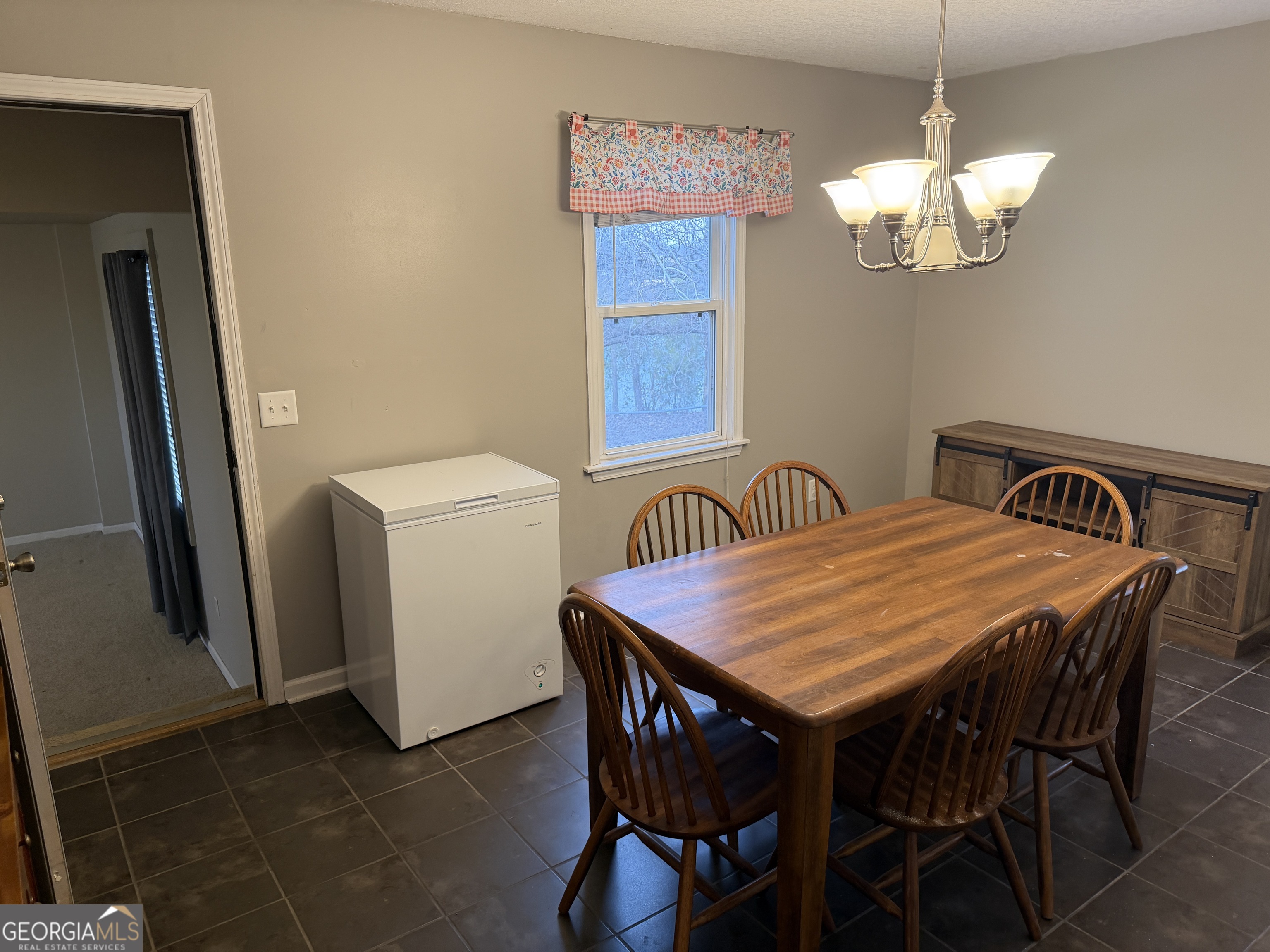 141 Evergreen Church Road Cobbtown, GA 30420 - Photo 15 of 29 a dining room with a table and chairs