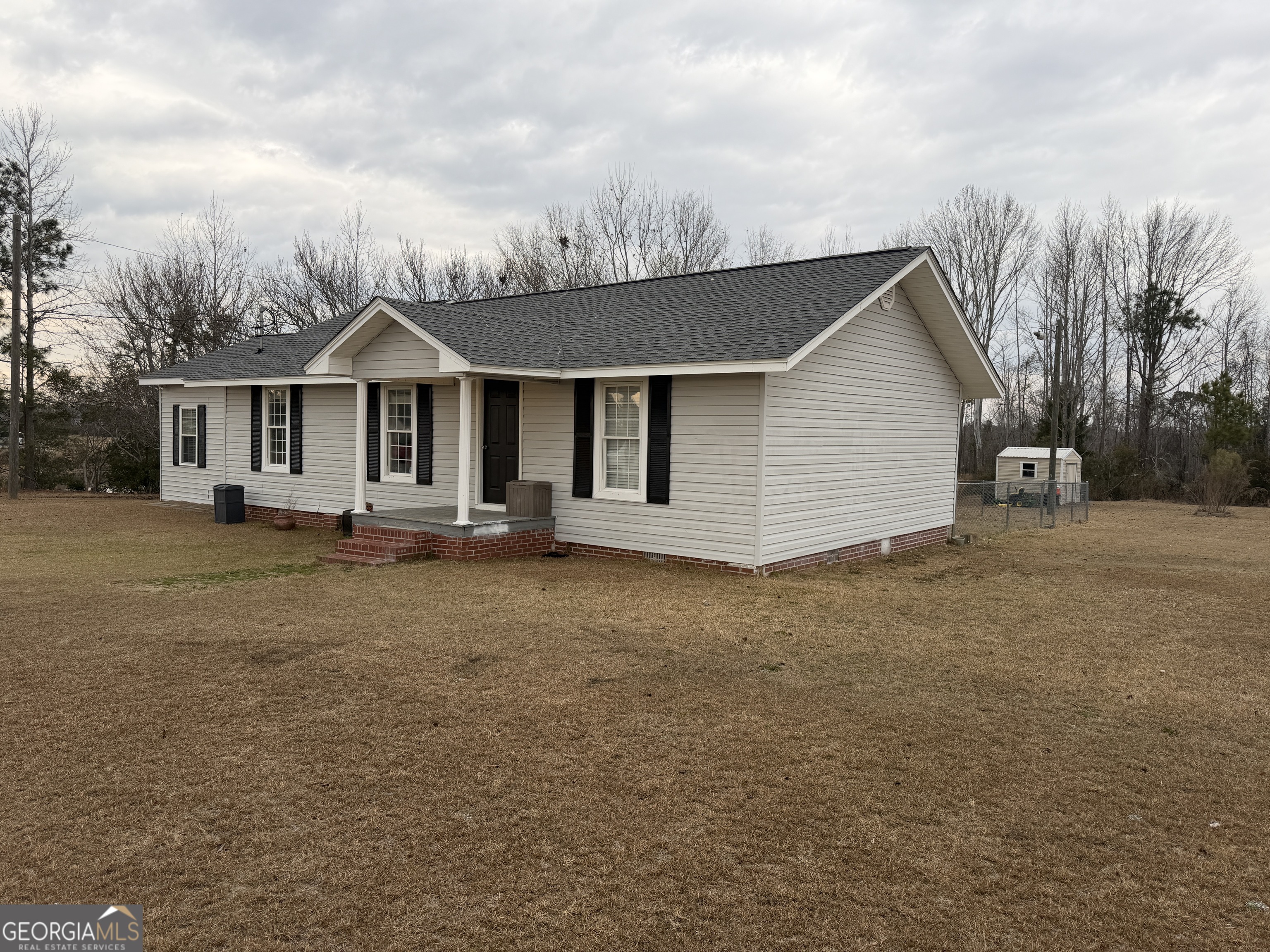 141 Evergreen Church Road Cobbtown, GA 30420 - Photo 28 of 29 a view of a house with a backyard