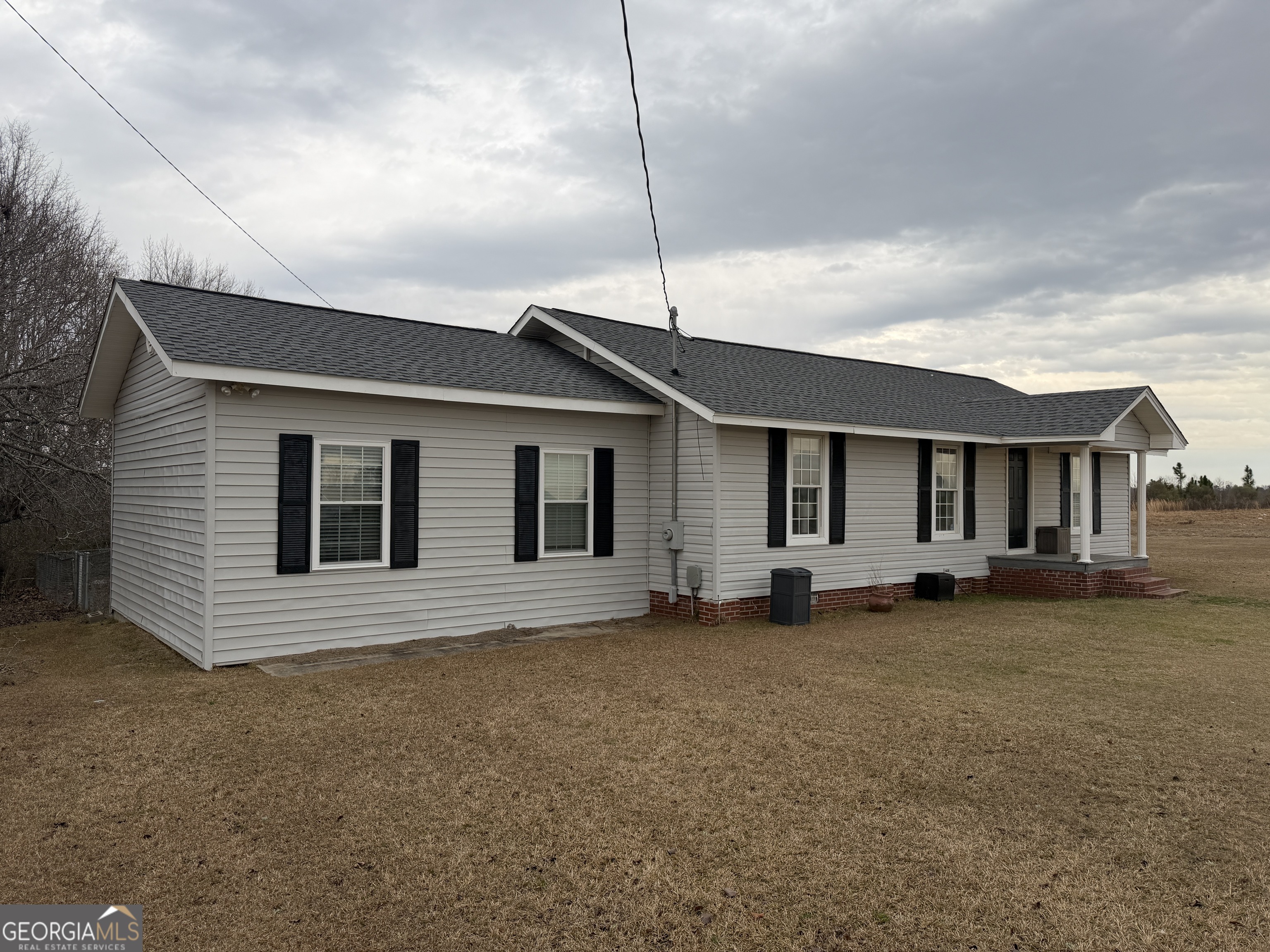 141 Evergreen Church Road Cobbtown, GA 30420 - Photo 29 of 29 a view of a house with a yard